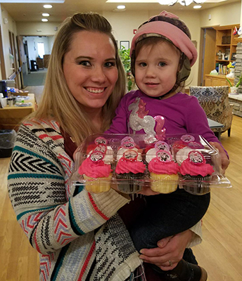 Leslie Engstrom of Hospice (and daughter, Harlee) brought by cupcakes for staff today as her random act of kindness